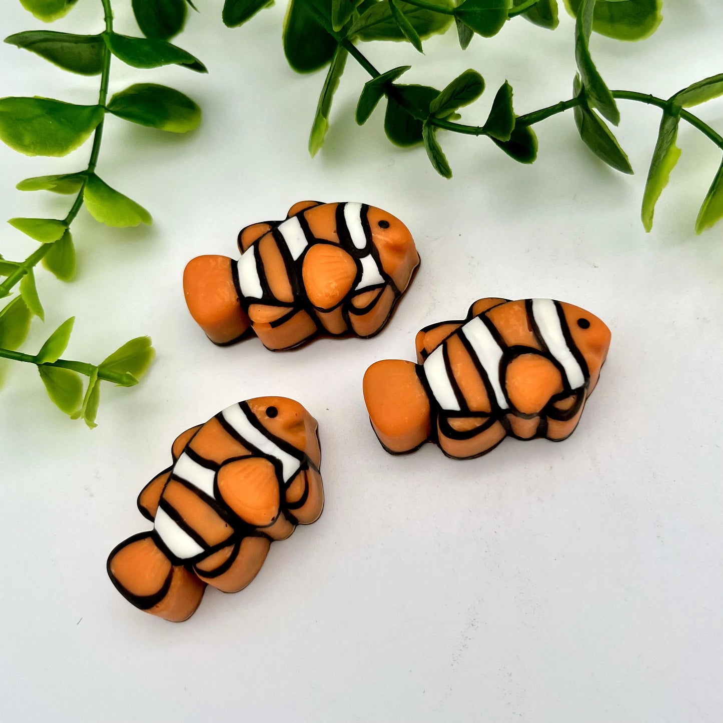 Clownfish chocolates, brilliantly detailed in orange, black and white.