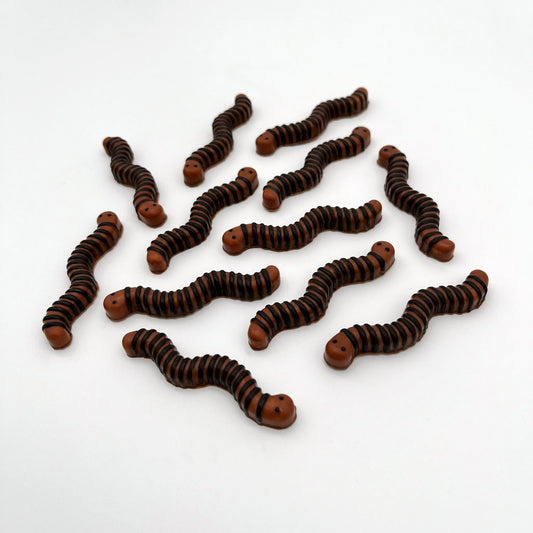 Realistic-looking brown and black chocolate worms.
