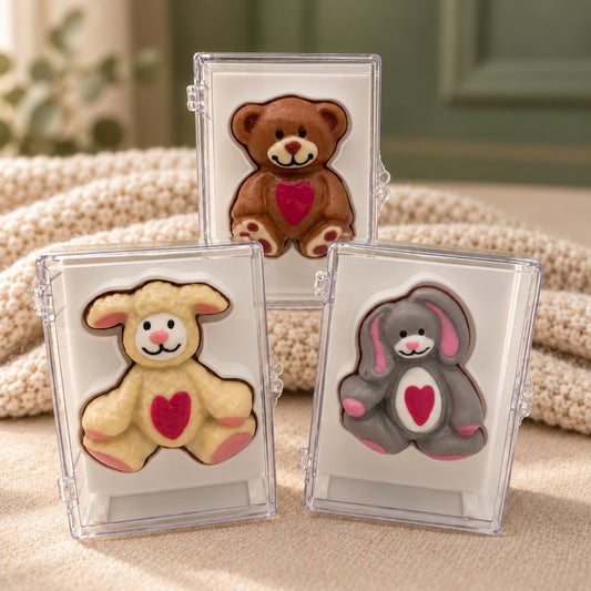 Teddy bear, lamb and bunny with red hearts, made from chocolate, each in its own clear acrylic gift box.
