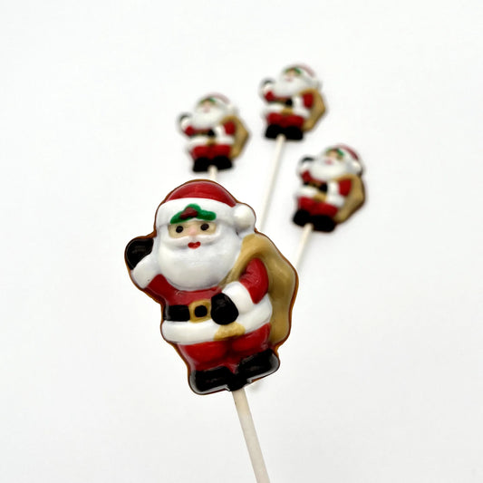 Chocolate Santa Claus in a traditional red and white suit, holding a sack and waving.