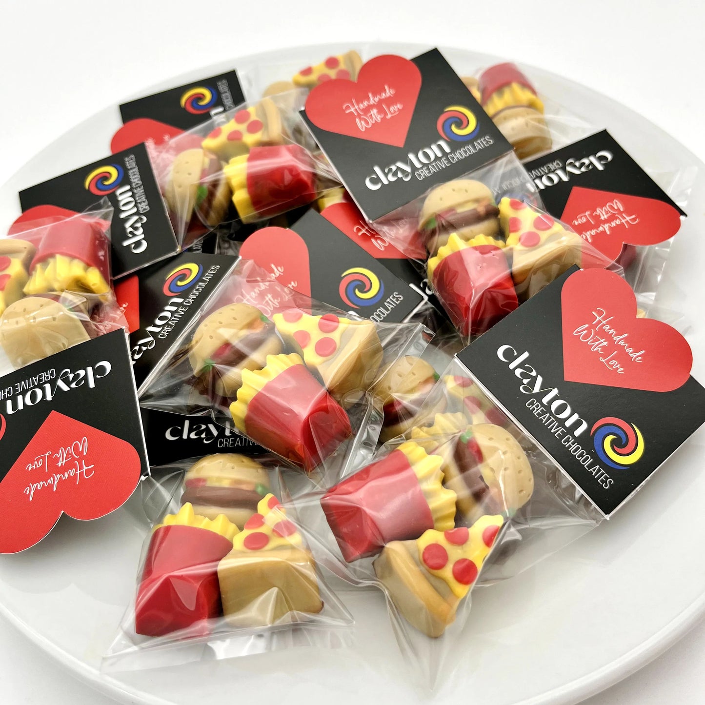 Realistic and colourful pizza slices, burgers and fries, all made from chocolate. Displayed in sets of 3 in Clayton Creative Chocolate packaging.
