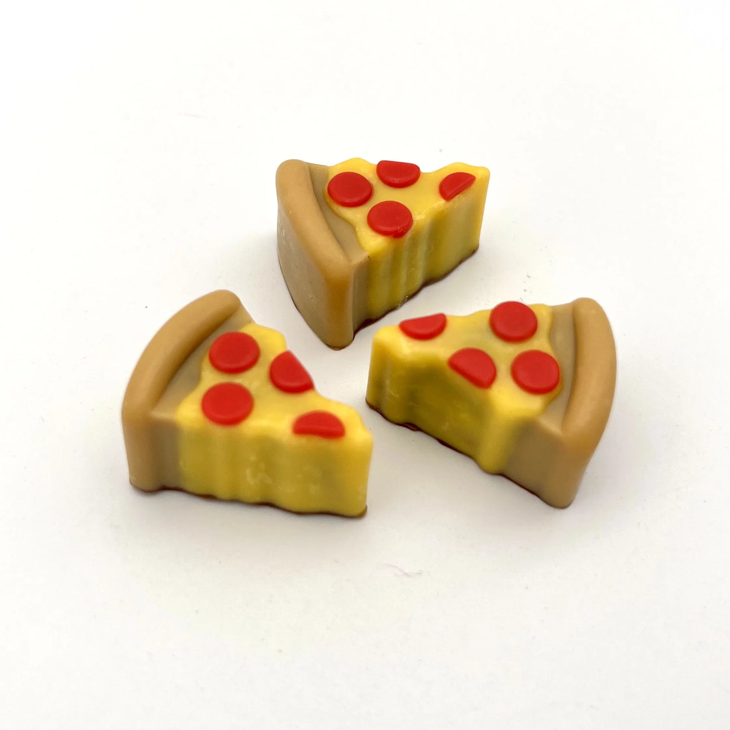 Realistic and colourful pizza slices made from chocolate.