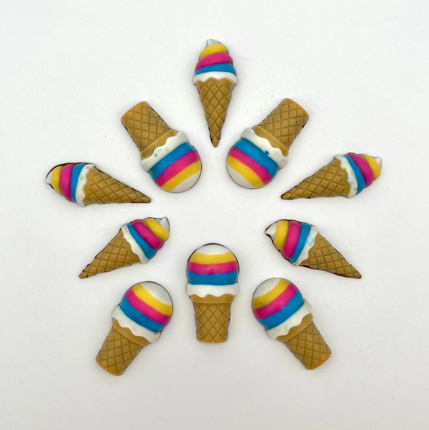 Vibrant chocolate ice cream cones arranged in a circular pattern. Hand-painted in bright rainbow colours and detailed waffle-like cone.