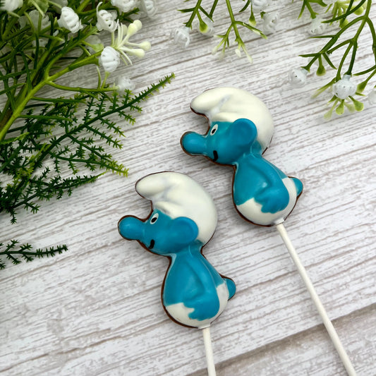Side profile of two blue and white Smurf suckers, filled with milk chocolate.