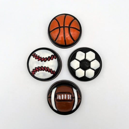 Large, round, medallion-style sports balls made from chocolate. Basketball, soccer, football and baseball hand-painted in traditional ball colours.