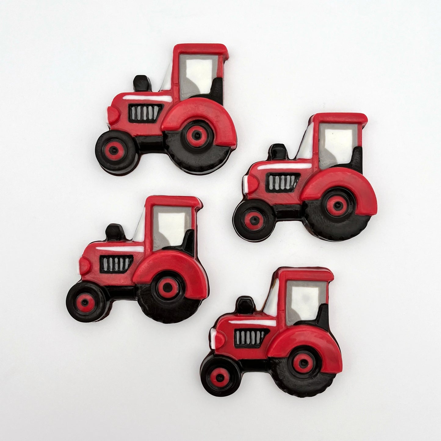 Chocolate farm tractors in signature Massey or Case IH red colour palette. For anyone who loves farming and the countryside.