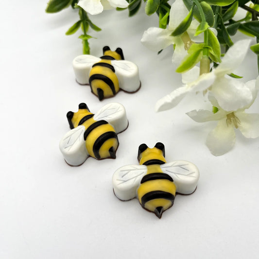 Chocolate bees, hand-painted in traditional yellow and black stripes , black eyes and white wings.