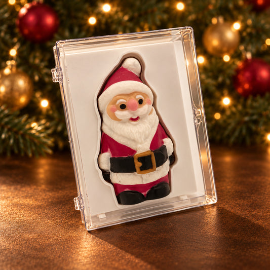 Chocolate Santa with a red hat and suit, white beard and gold belt buckle in a clear acrylic gift box.