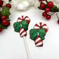 Red and white striped candy cane chocolates with two-toned green bow.