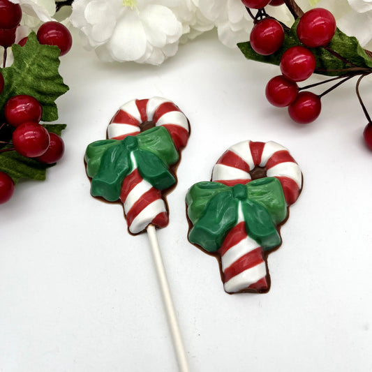 Red and white striped candy cane chocolates with two-toned green bow.