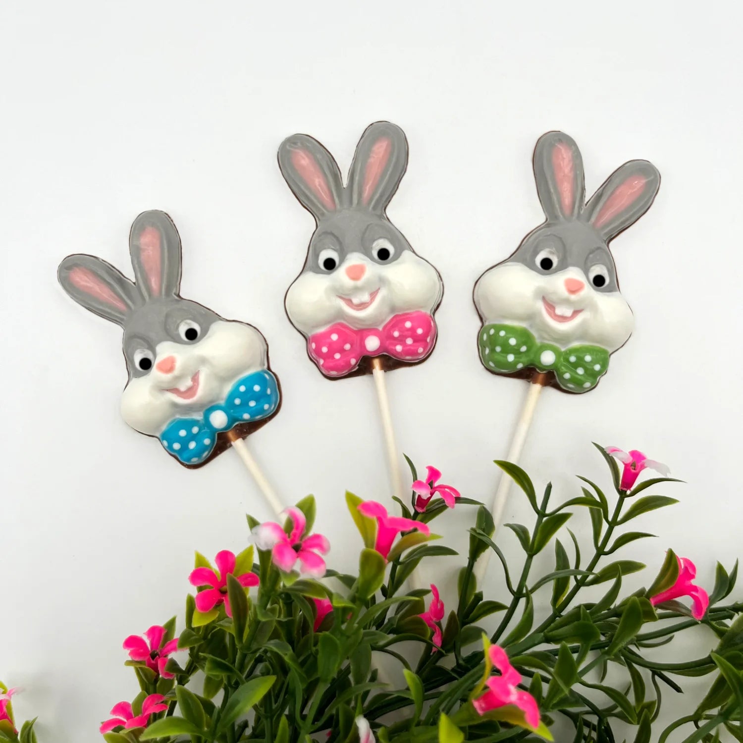 "Bugs" Bunny inspired chocolate sucker with a coloured polka dot bowtie. Grey and white add authenticity to the classic cartoon character.