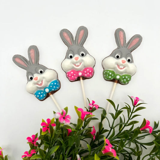 "Bugs" Bunny inspired chocolate sucker with a coloured polka dot bowtie. Grey and white add authenticity to the classic cartoon character.