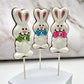Easter Bunny suckers coloured in white and pink, adorned with polka dot bowties in pink, green or blue. Filled with milk chocolate.