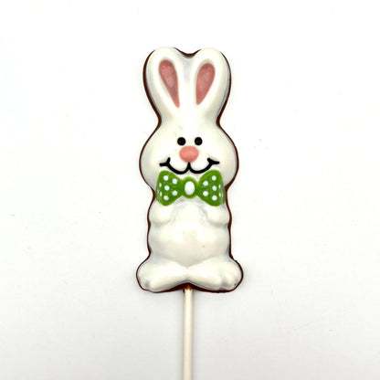 Chocolate Easter Bunny sucker coloured in white and pink, adorned with green polka dot bowtie.