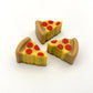 Realistic and colourful pizza slices made from chocolate. 