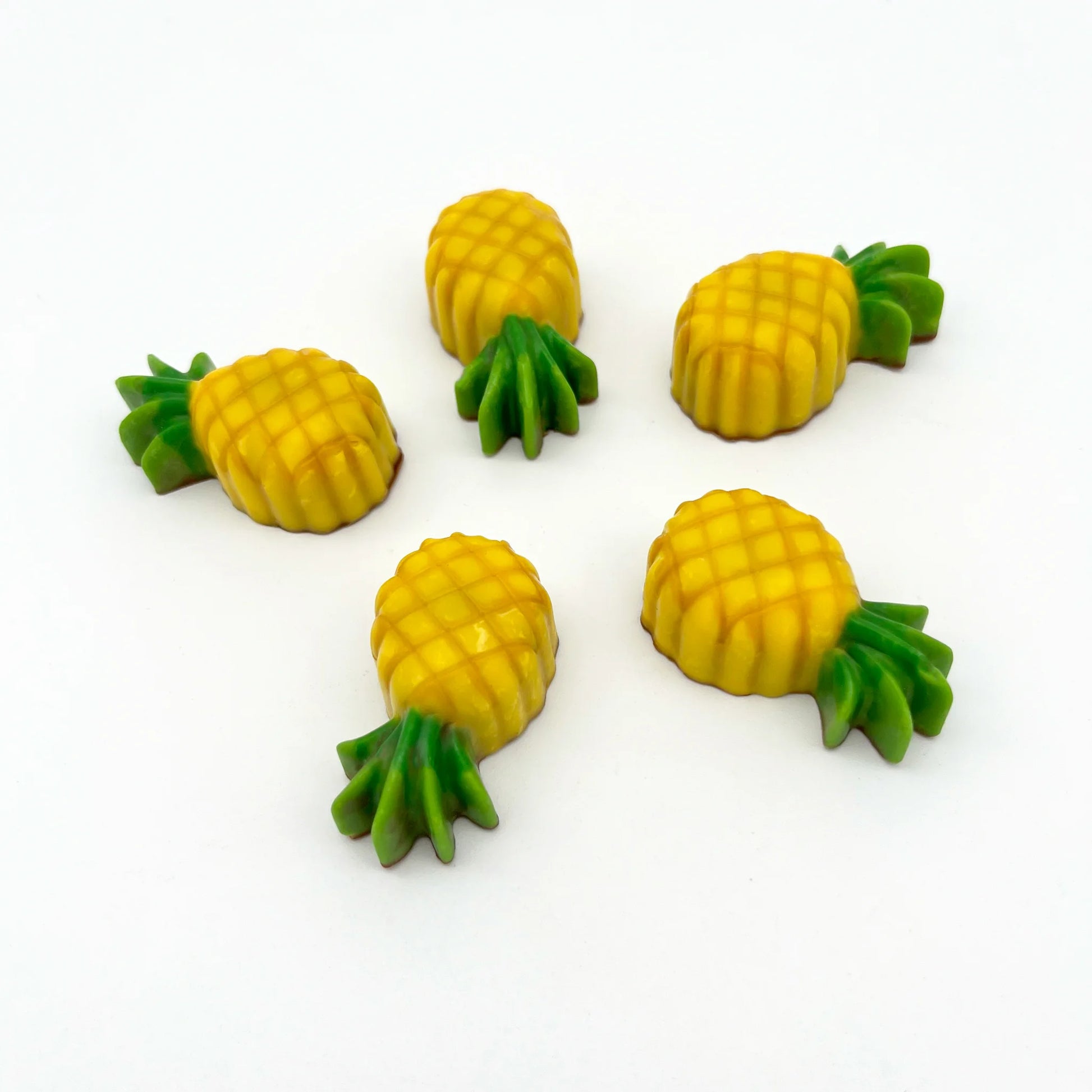 Yellow and green pineapples made from chocolate.