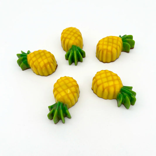 Yellow and green pineapples made from chocolate.