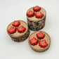 Selection of chocolate maple leaves, hand-painted in a blend of yellow, orange and red fall seasonal colours.