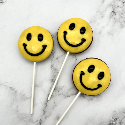 A jumbo version of the classic yellow and black smile emoji, but made from chocolate.