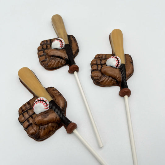 Baseball glove, bat and ball in realistic colours of brown, black, white and red - all made from chocolate as suckers.